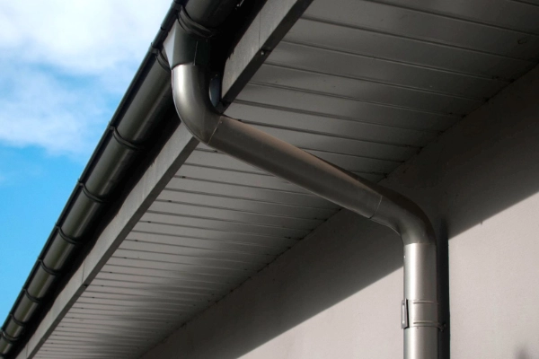 Metal gutter connected to a residential downpipe