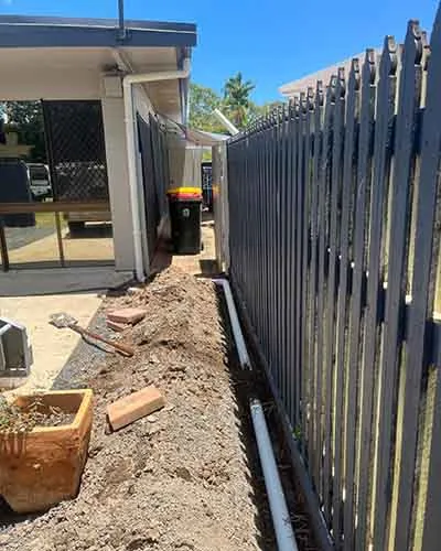 Stormwater pipe installed in a side-yard trench