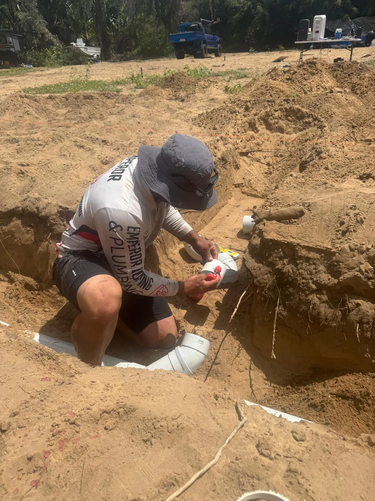 Emperor plumber completing an urgent underground drainage repair